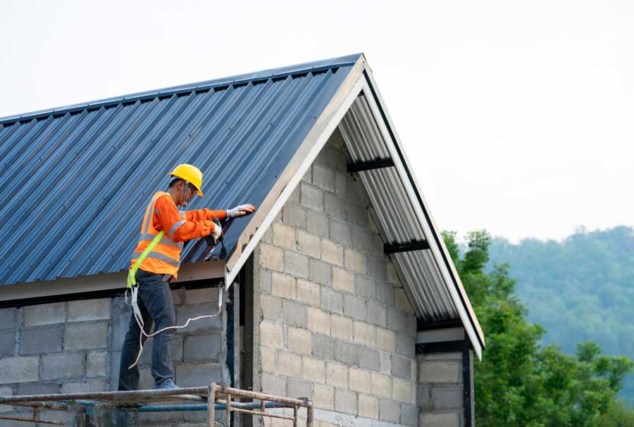 Roofer handling a roof repair job
