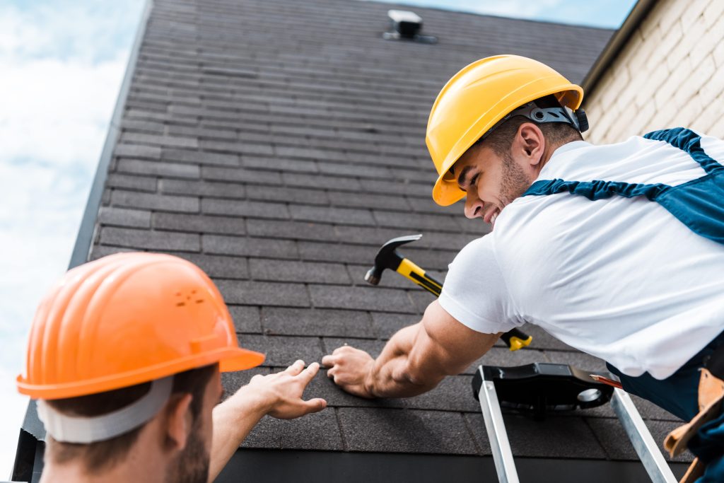 New roof installation in progress on a suburban house
