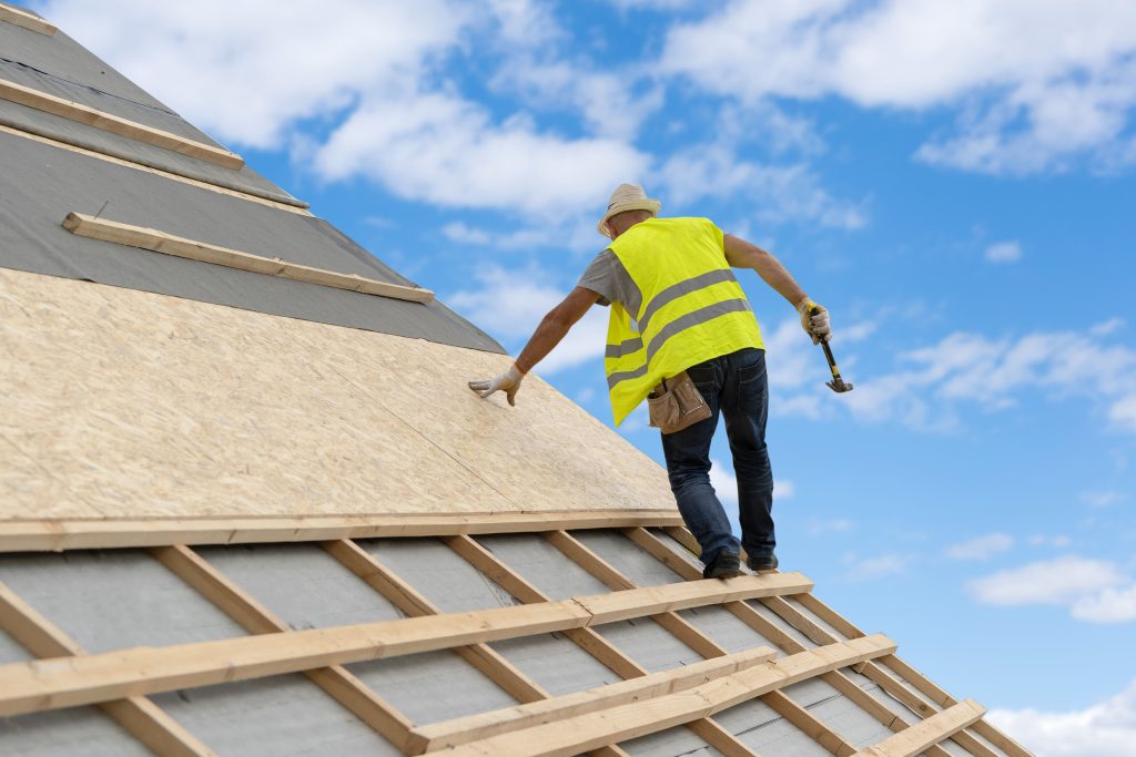 Close-up of shingles and roofing tools on a home renovation project